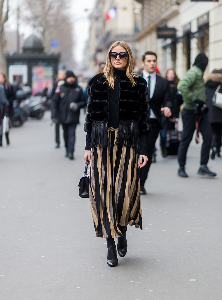 PARIS, FRANCE - JANUARY 25: Olivia Palermo wearing a black fur jacket, striped skirt outside Elie Saab on January 25, 2017 in Paris, Canada. (Photo by Christian Vierig/Getty Images)